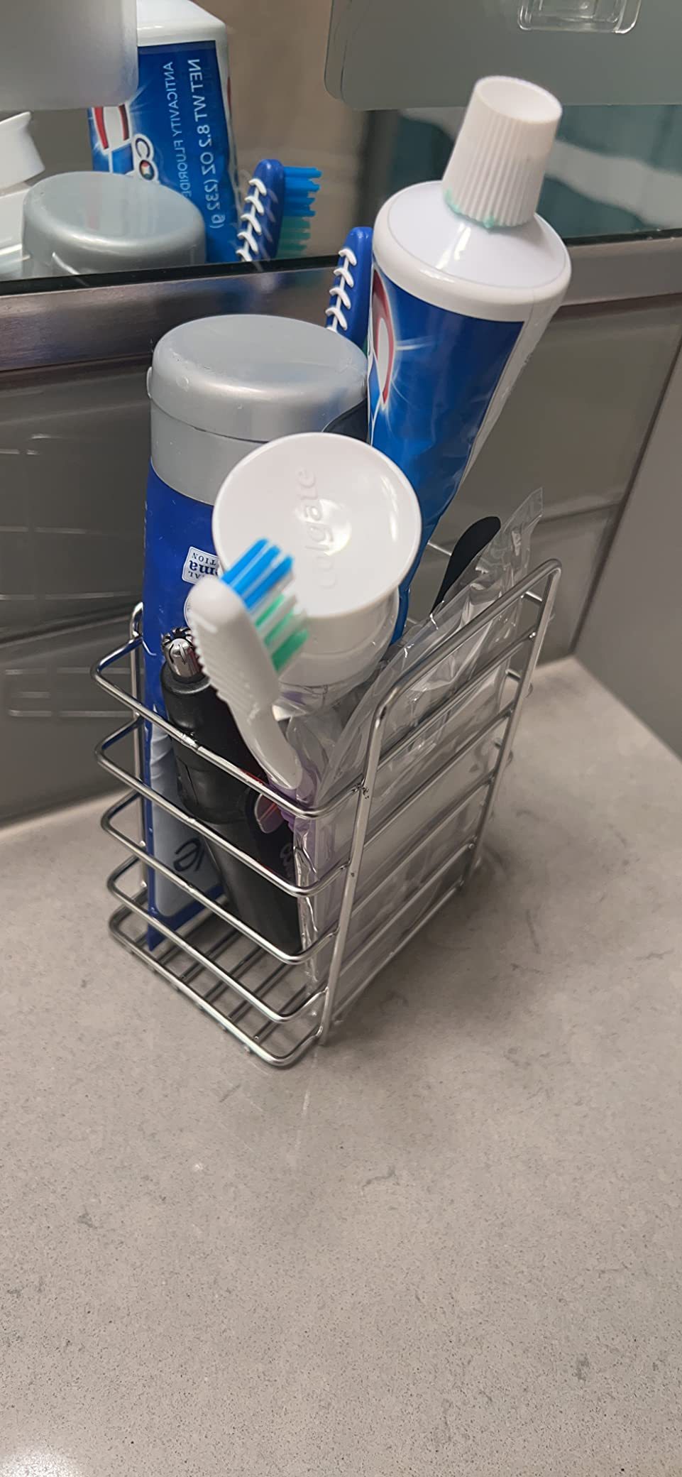 Shower caddy with soap dish and multiple hooks for hanging toiletries, designed for bathroom organization and easy access