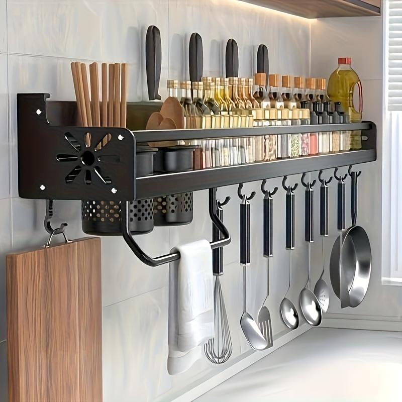 Wall-mounted stainless steel kitchen utensil holder with built-in spice racks, ideal for camping and home kitchen organization