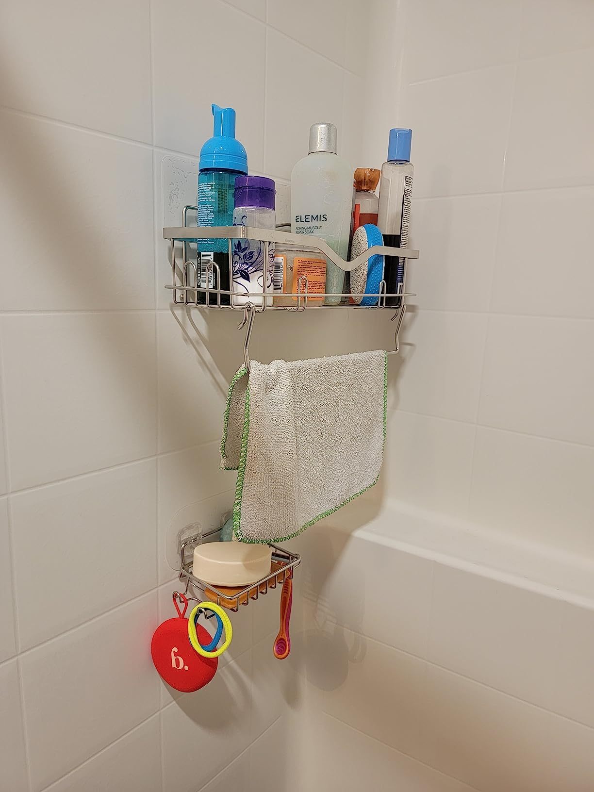 Shower caddy with soap dish and multiple hooks for hanging toiletries, designed for bathroom organization and easy access