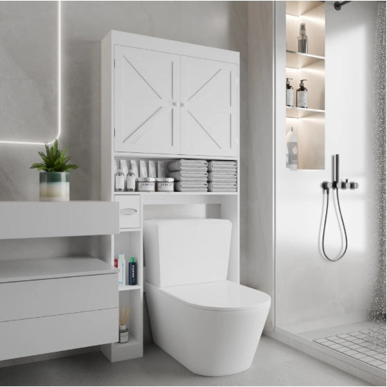 White over-the-toilet storage cabinet with two farmhouse-style doors and open bottom shelf for bathroom organization.